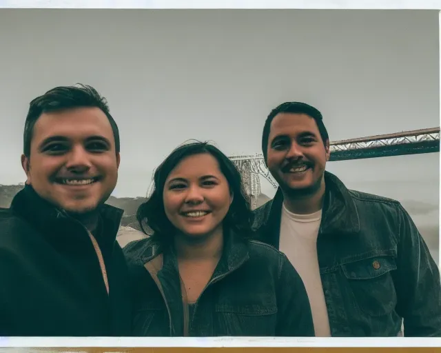 the Golden Gate Bridge in the background of three people standing next to each other