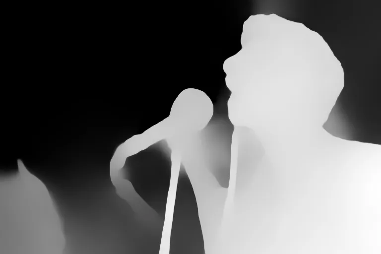 Depth map. Atif Aslam singing on stage with a lively crowd in the background