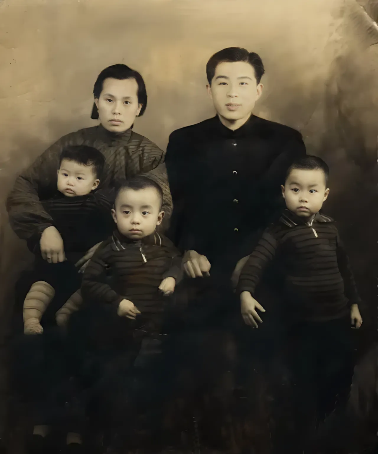 an old photo of a family posing for a picture