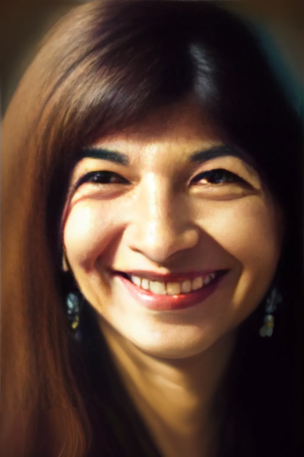 a portrait of Alka Yagnik, close-up, smiling, natural lighting
