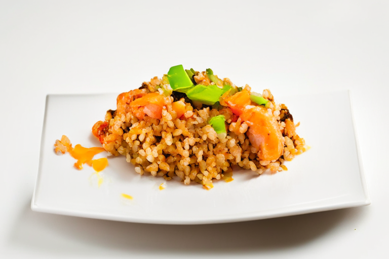 A plate of Khao Pad Kung (Thai Shrimp Fried Rice) on a white surface, bright clear studio lighting, razor-sharp focus