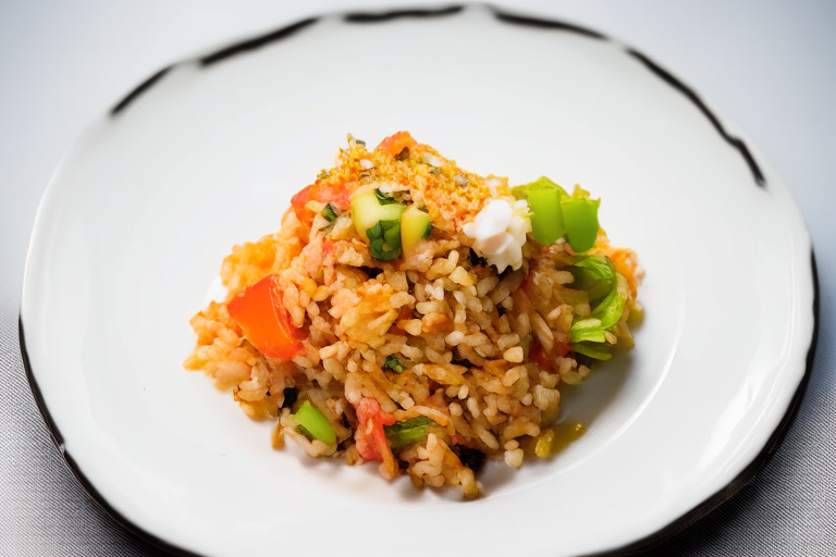 A overhead view of Khao Pad Kung (Thai Shrimp Fried Rice) with Thai decoration on a white plate, bright clear studio lighting, razor-sharp focus