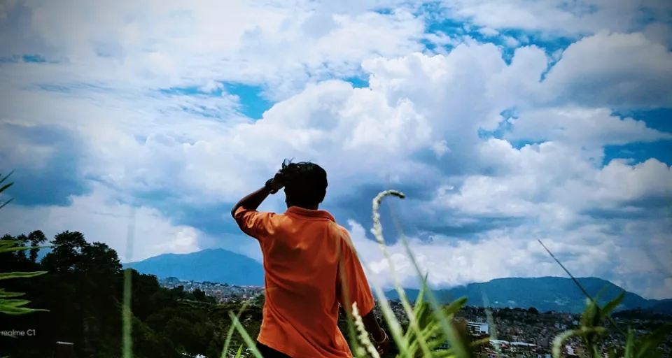 a man is flying a kite in the sky a chinese karateka with a long bamboo stick in his right hand, in a deep forest, seen from behind, cinematic view, beautiful composition, ambient light, fog, wide angle, 8k, epic, ray traced, sharp focus, depth of field