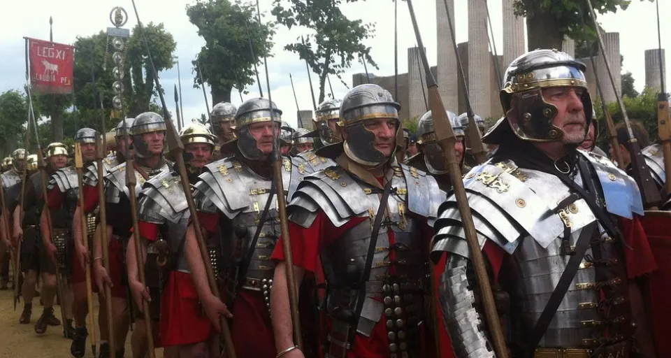 a group of men dressed in roman armor