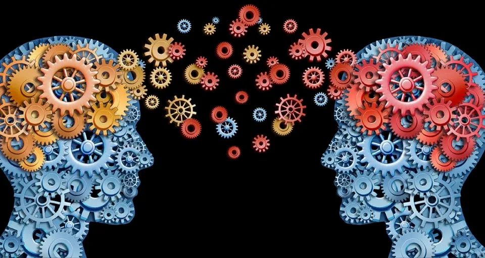 a couple of people with gears in their heads