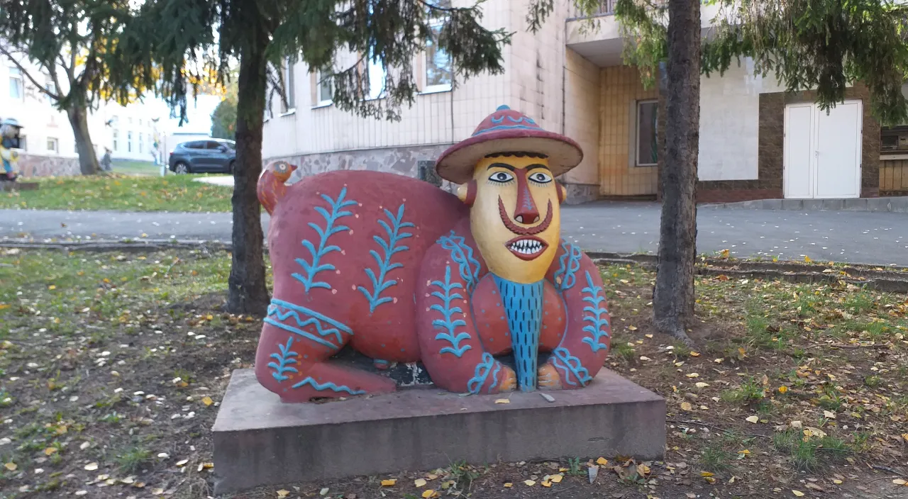 a statue of a bear wearing a hat