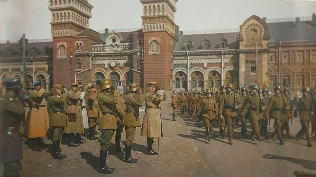 a group of men in uniforms standing in front of a building