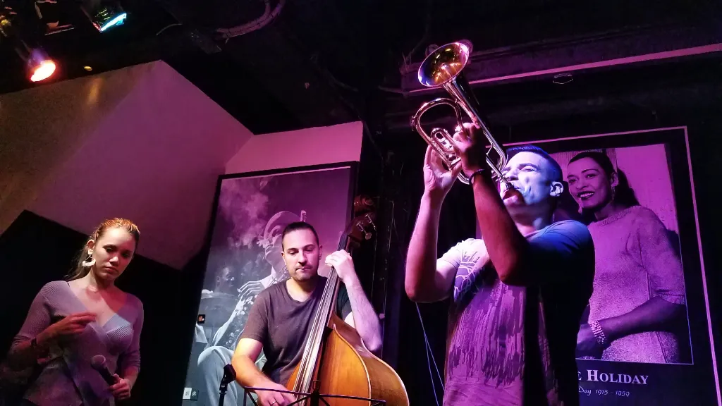 a group of people playing musical instruments on a stage