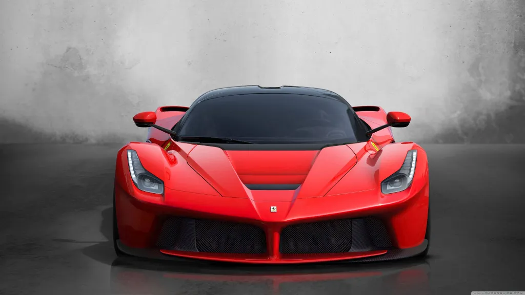 a red sports car parked in a garage