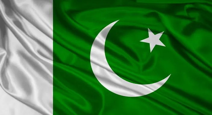 the flag of pakistan waving in the wind