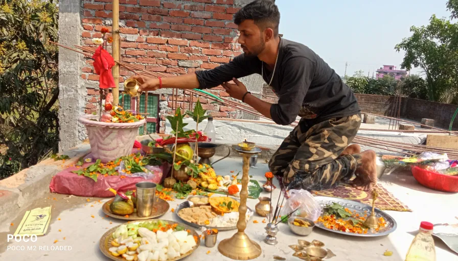 a man preparing food on a table outdoors