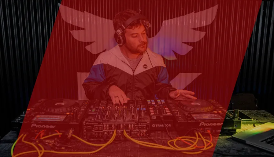 a man sitting at a table with headphones on