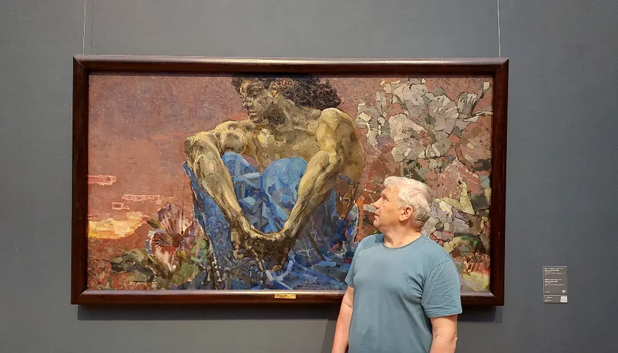 a man standing in front of a painting on display