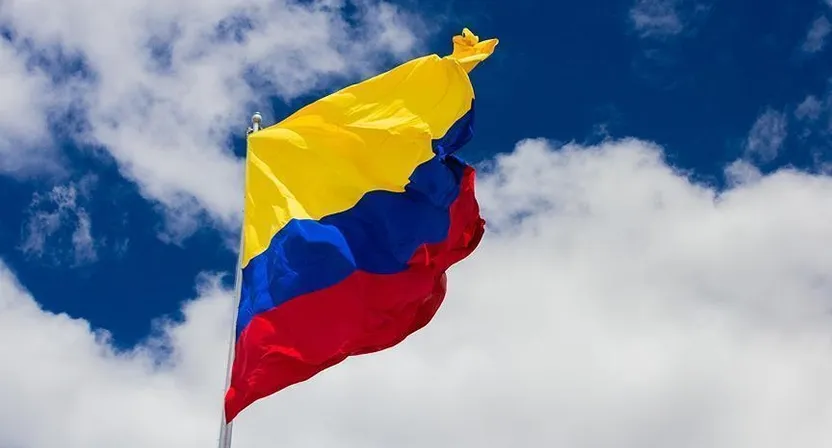 a flag flying in the wind on a cloudy day