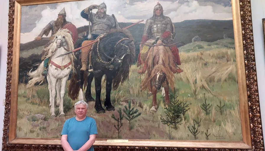 a man standing in front of a painting of men on horses