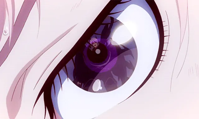 a close up of a purple eye with long eyelashes