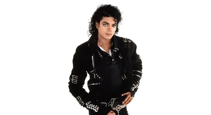 Michael Jackson in a black jacket and white shirt