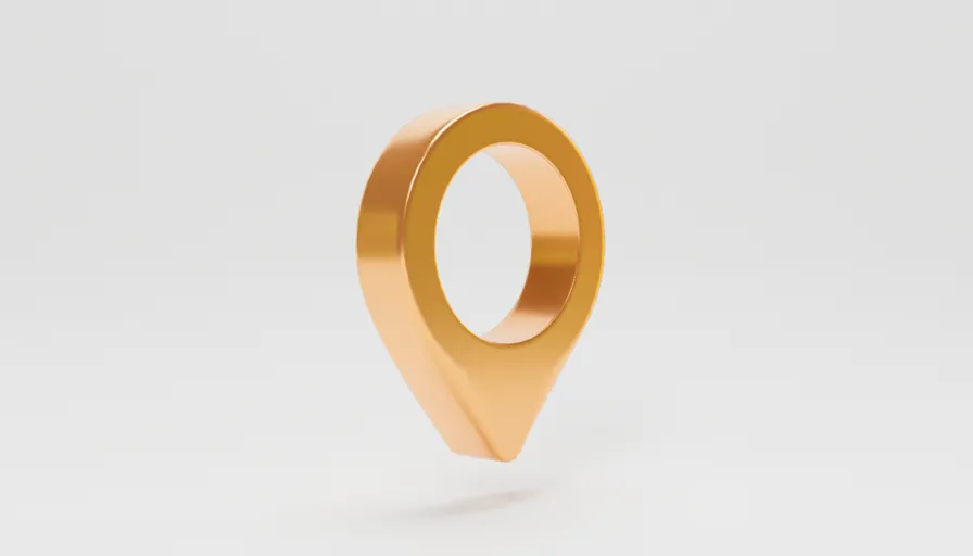 a gold ring that is shaped like a map pin