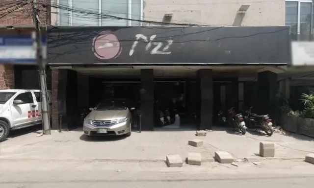 a car is parked in front of a building