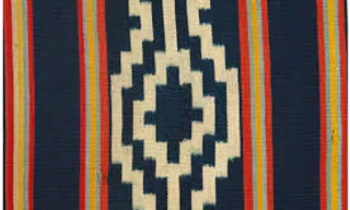 a blue, yellow, red, and white striped quilt