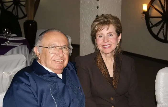 a man and a woman sitting next to each other