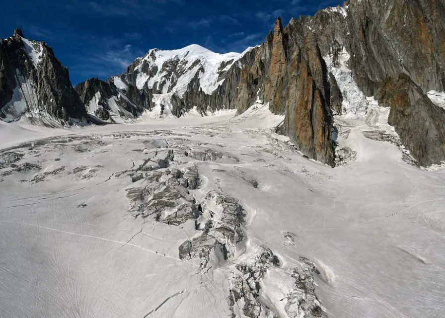 a snow covered mountain with a sky background