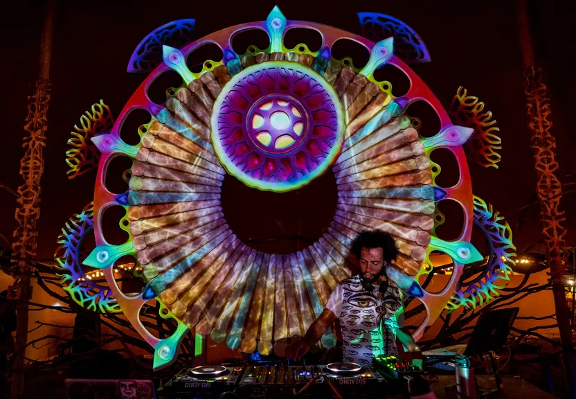 a man standing in front of a colorful display