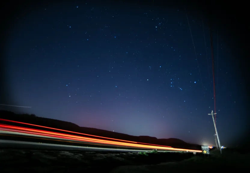a long exposure photo of the night sky