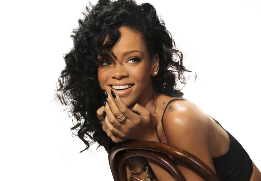 a woman sitting in a chair with a smile on her face