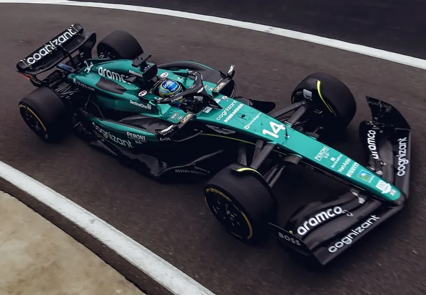 a man driving a racing car on a race track
