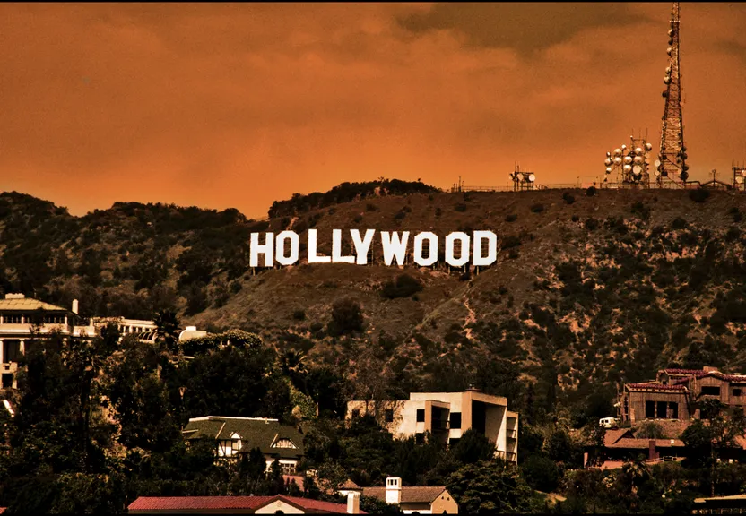 the hollywood sign is on top of a hill