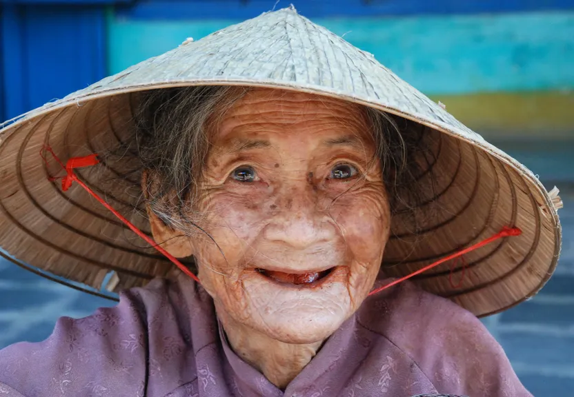 an old woman wearing a hat with arrows on it