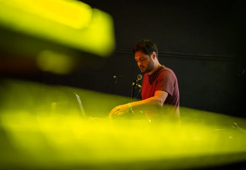 a man sitting in front of a laptop computer