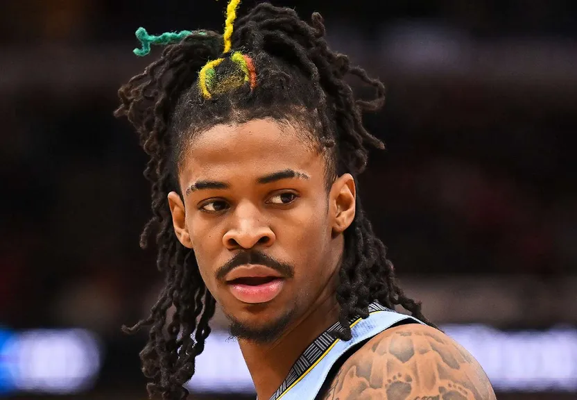 a close up of a basketball player with dreadlocks