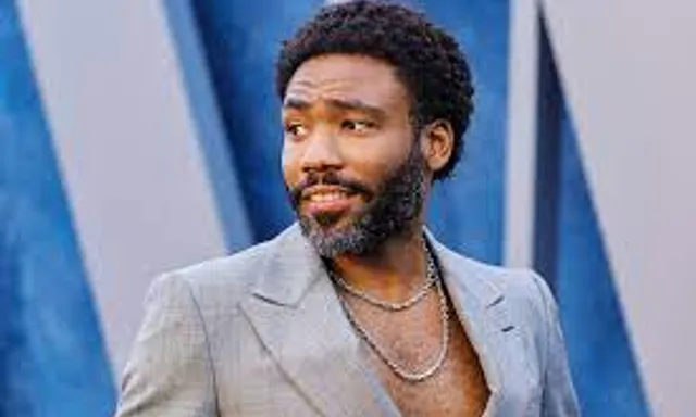 a man with a beard wearing a suit