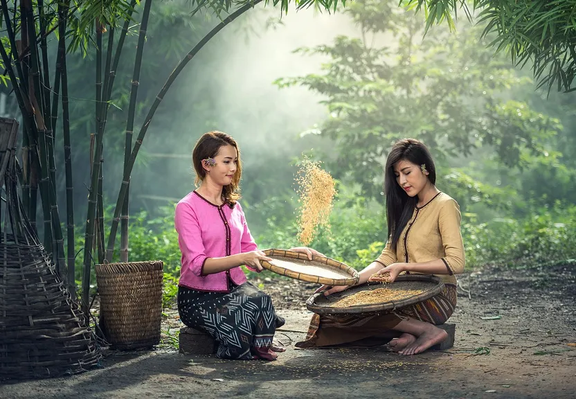 a couple of women sitting next to each other