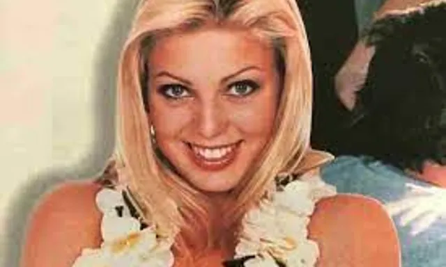 a woman with blonde hair wearing a flower collar