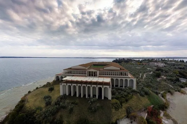 an aerial view of a large building near the ocean