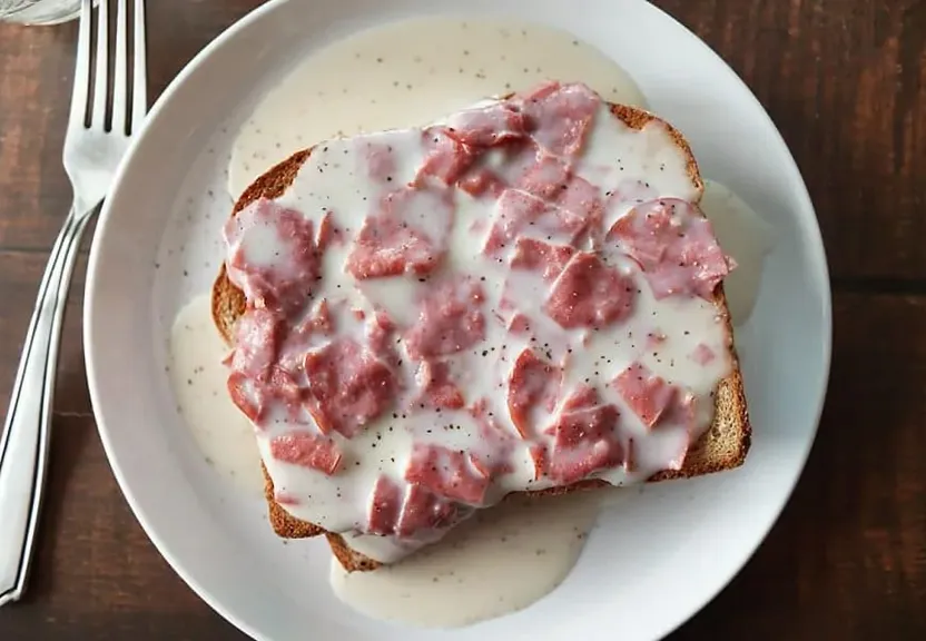 a plate of food that has some kind of meat on it