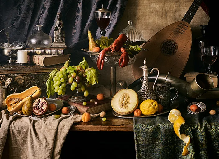 a still life of food and wine on a table