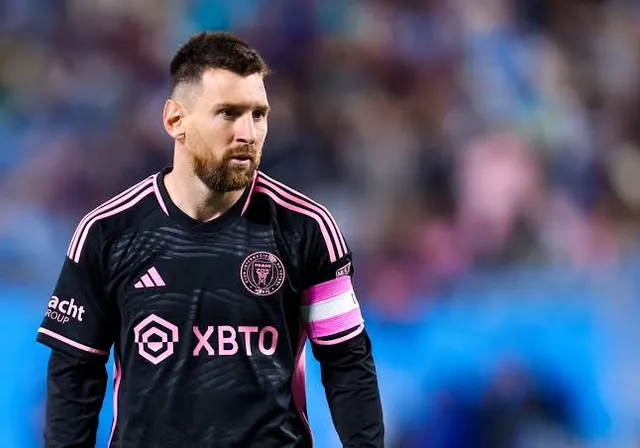 Messi with a beard wearing a black shirt make him look like a real messi