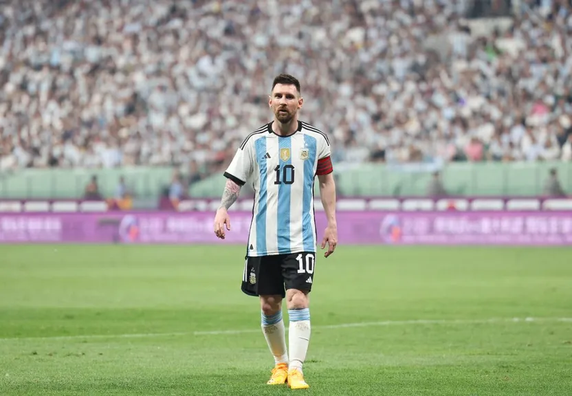 a man standing on top of a soccer field