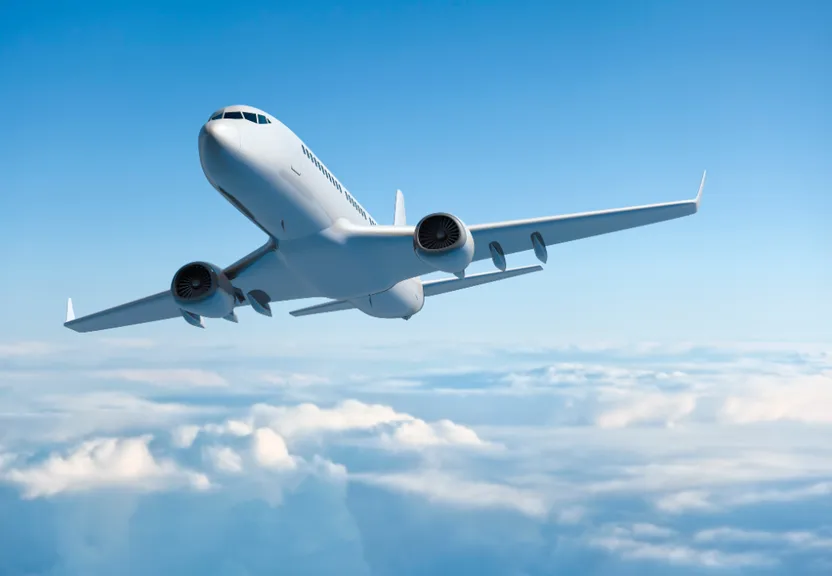 a large jetliner flying through a blue sky