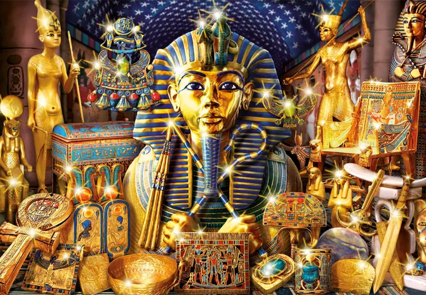 a large egyptian statue surrounded by other items