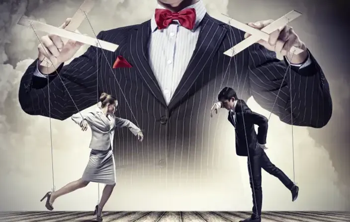 a man in a suit and a woman in a dress are balancing on strings