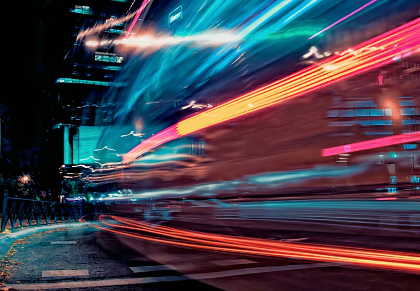 a blurry photo of a city street at night