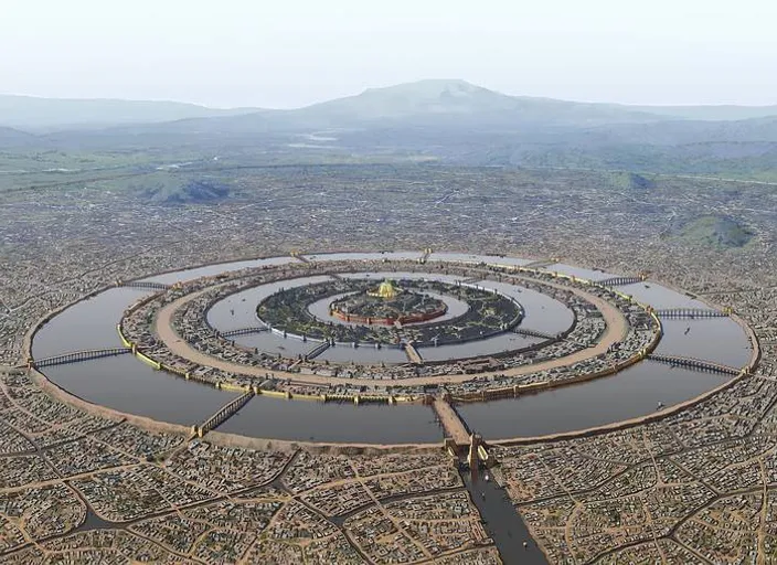 an aerial view of a circular structure in the middle of a city