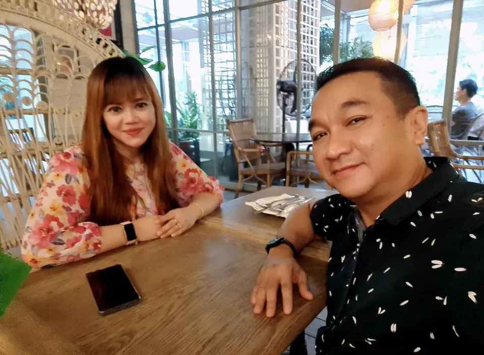 a man and a woman sitting at a table