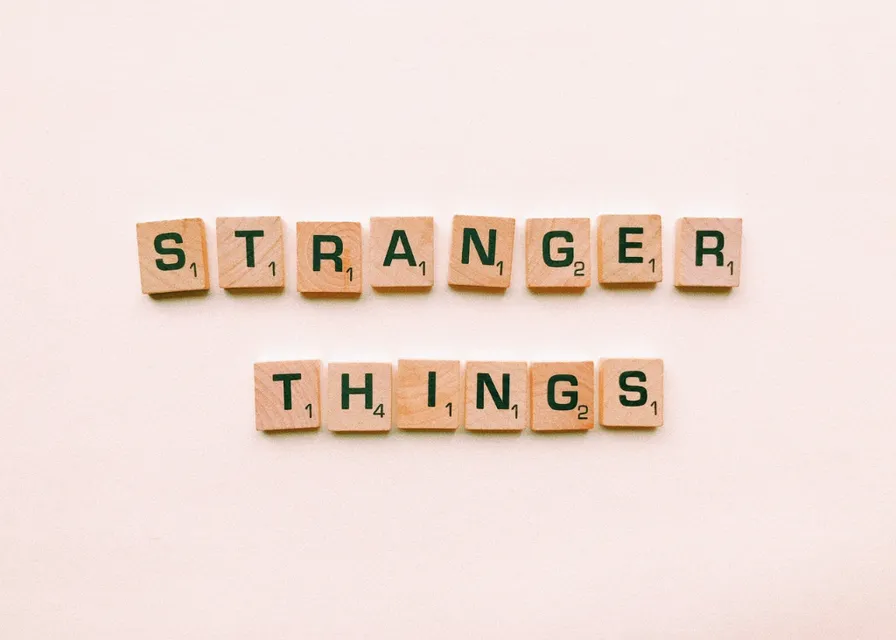 scrabbled scrabble letters spelling out the word'stranger things