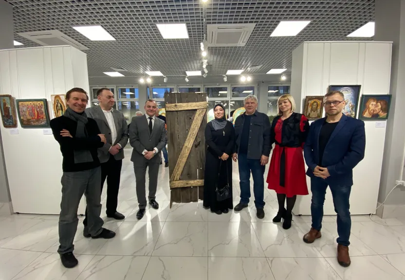 a group of people standing in a room